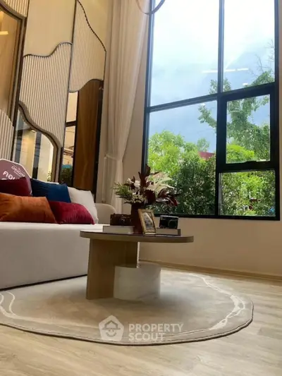 Luxurious living room with large window and stylish decor