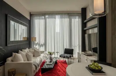 Luxurious modern living room with elegant decor and large windows for natural light.