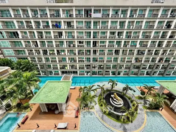 Luxurious condominium with stunning pool and garden view from balcony