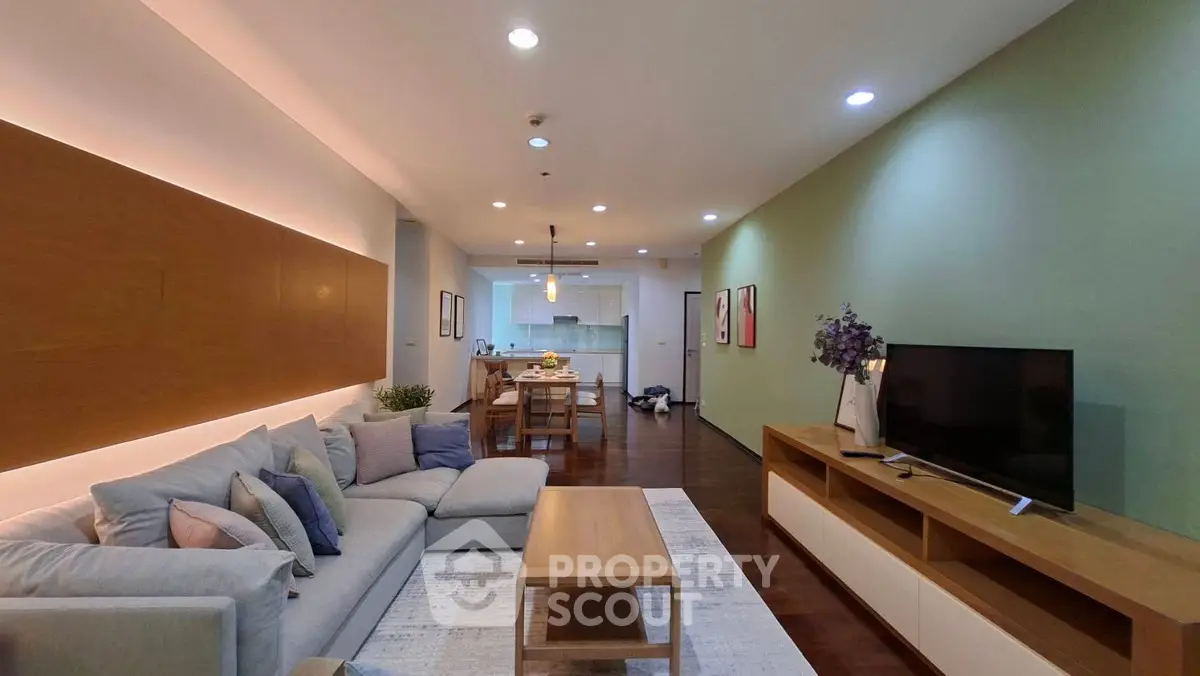 Spacious modern living room with stylish decor and open kitchen layout