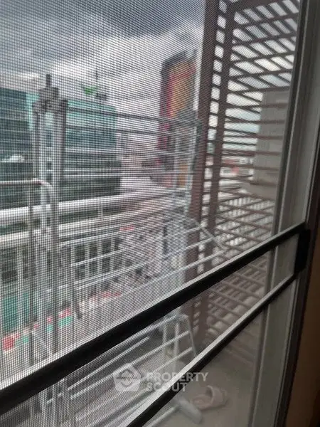 Urban balcony view with cityscape and modern architecture