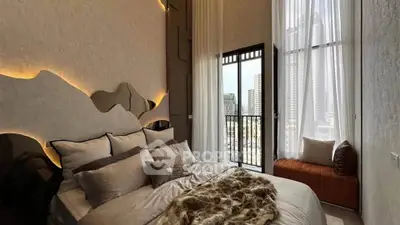 Luxurious bedroom with modern decor and stunning city view from balcony