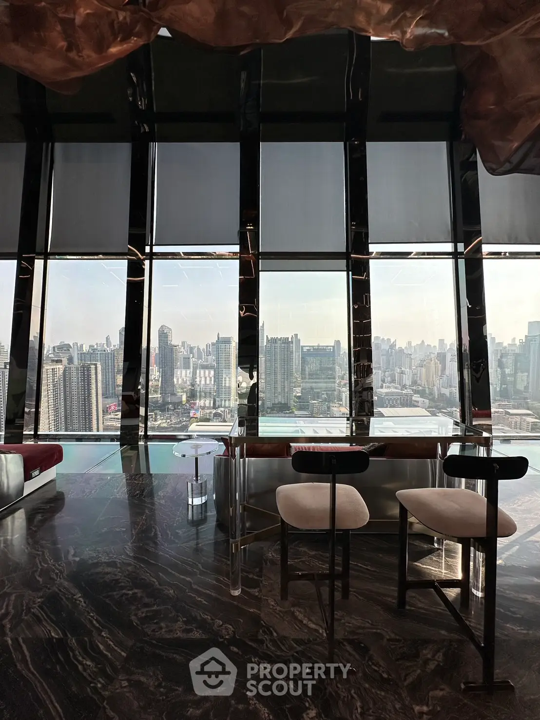 Luxurious high-rise apartment with stunning city skyline view and elegant interior design.