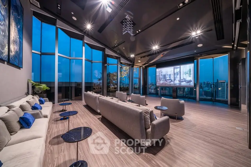 Luxurious modern living room with panoramic city views and elegant decor.