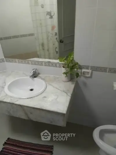 Modern bathroom with marble sink and stylish decor