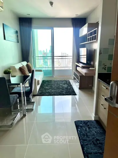 Modern living room with balcony view in high-rise apartment