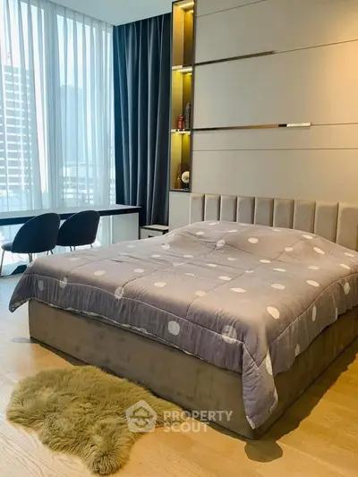 Luxurious bedroom with modern decor and city view, featuring a plush bed and elegant furnishings.