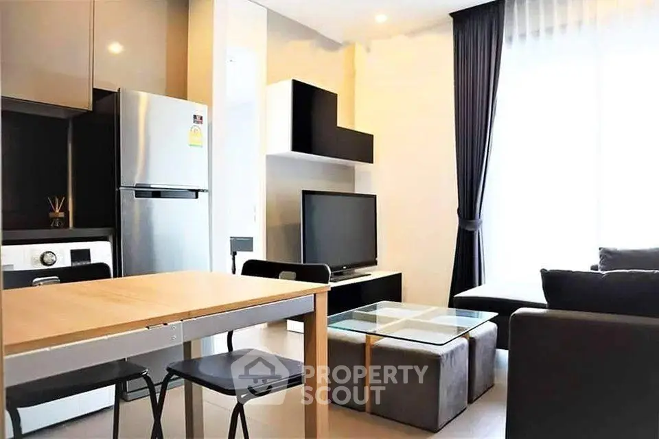 Modern living room with sleek furniture and natural light, featuring a stylish open layout and contemporary design.