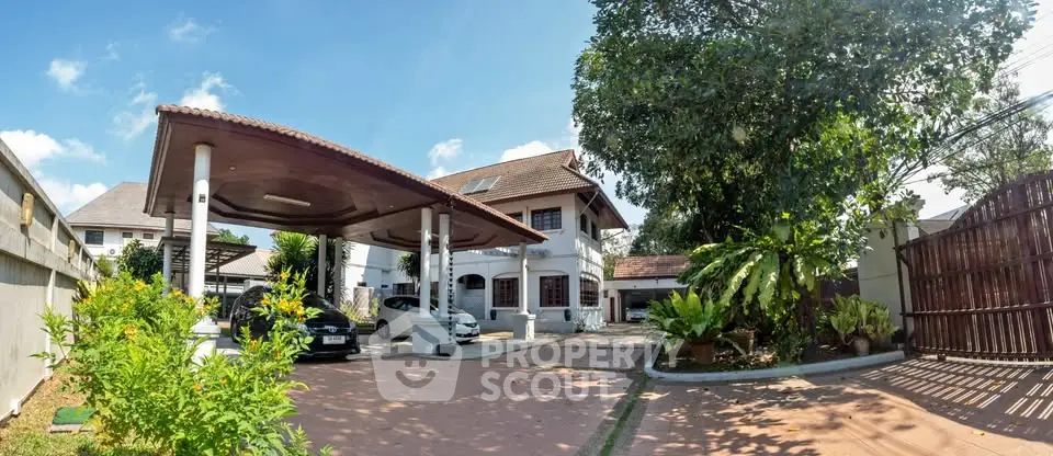 Spacious suburban home with carport and lush garden in a serene neighborhood.