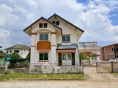 Charming two-story house with unique architectural design and spacious driveway in a serene neighborhood.