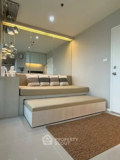 Modern living room with sleek furniture and elegant lighting, perfect for urban living.