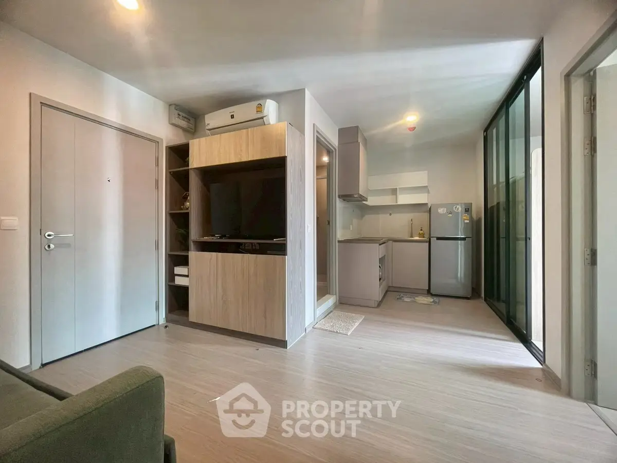 Modern open-plan living area with sleek kitchen and stylish decor