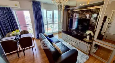 Luxurious living room with city view, elegant decor, and modern amenities in high-rise apartment.