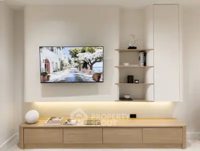 Modern living room with sleek TV setup and stylish shelving