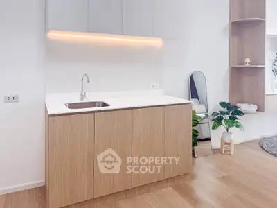 Modern minimalist kitchen with sleek cabinetry and integrated lighting