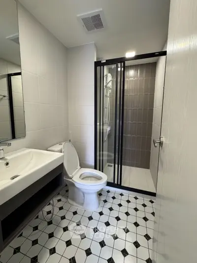 Modern bathroom with sleek shower and stylish tile flooring