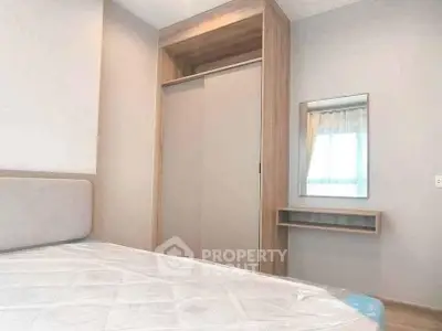 Modern bedroom with built-in wardrobe and natural light