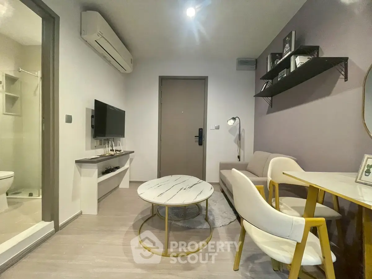 Modern living room with stylish furniture and air conditioning in a cozy apartment.