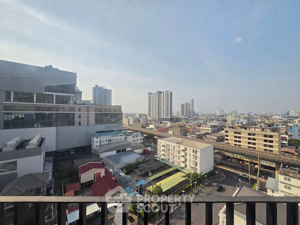 Stunning cityscape view from a high-rise balcony, showcasing urban living at its finest.