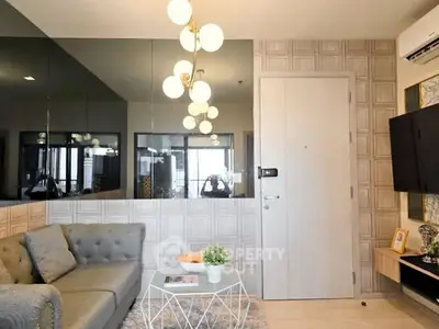 Modern living room with stylish decor and elegant lighting in a contemporary apartment.