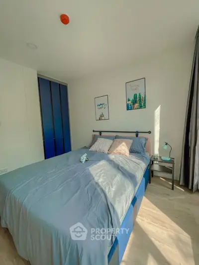 Bright and cozy bedroom with modern decor and ample natural light