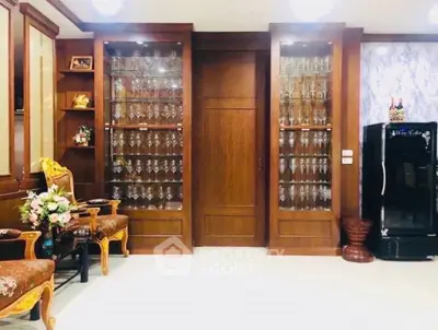 Luxurious living room with elegant glass display cabinets and vintage furniture