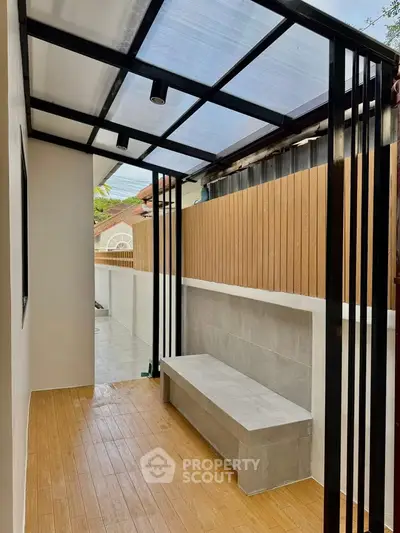 Modern outdoor patio with sleek design and wooden flooring, perfect for relaxation and entertainment.