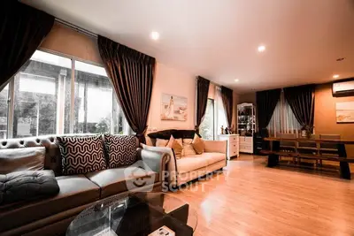 Spacious living room with elegant decor and large windows in modern home