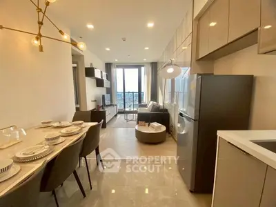 Modern open-plan living room with stylish kitchen and dining area