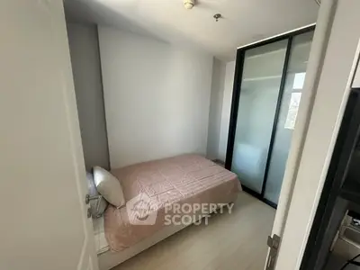 Cozy small bedroom with minimalist design and sliding door closet