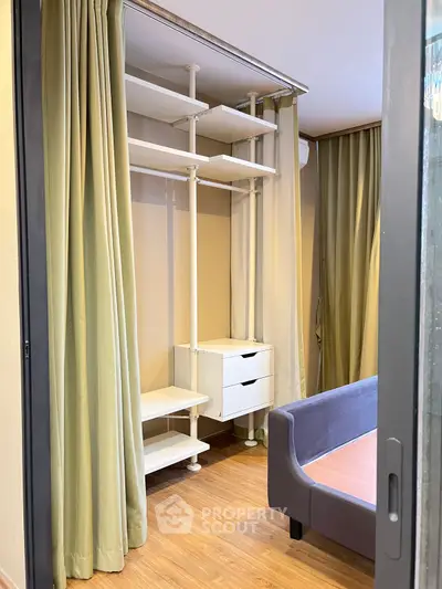Spacious bedroom with modern open closet and elegant curtains