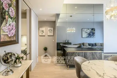 Elegant modern living room with mirrored wall and chic decor