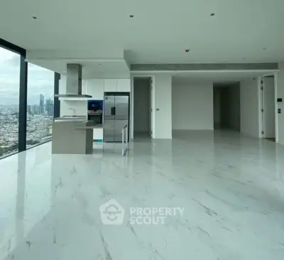 Luxurious open-plan living room with panoramic city views and modern kitchen.