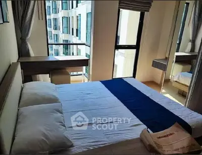 Modern bedroom with large windows and stylish decor in urban apartment