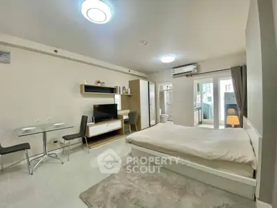 Modern studio apartment with open layout and stylish furnishings