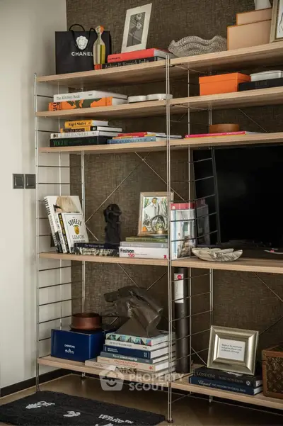 Stylish living room with modern shelving and decor, perfect for urban living.