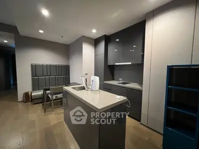Modern kitchen with sleek cabinetry and island in contemporary apartment