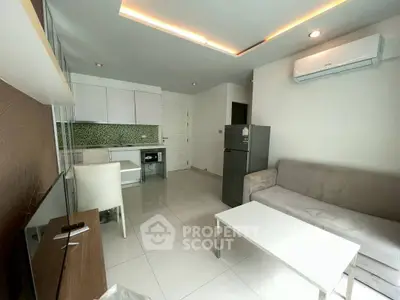 Modern living room with sleek furniture and open kitchen layout