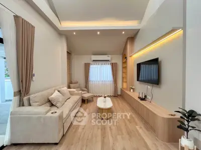 Modern living room with elegant decor and cozy seating area