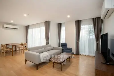 Spacious modern living room with elegant furniture and natural light