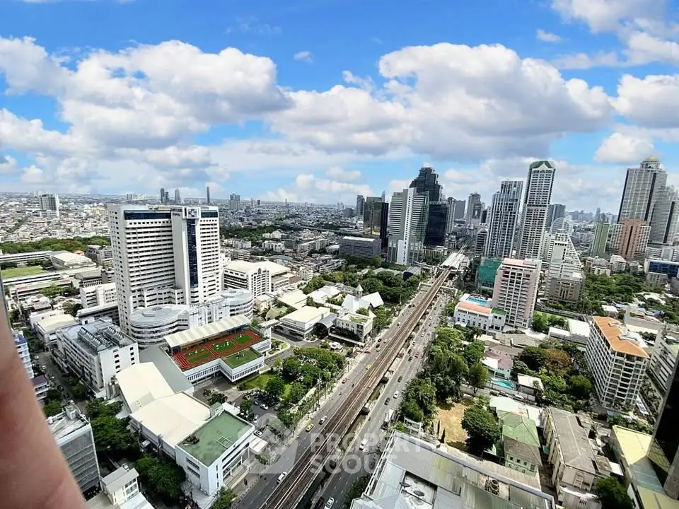 Stunning cityscape view showcasing modern skyscrapers and urban landscape under a vibrant blue sky.