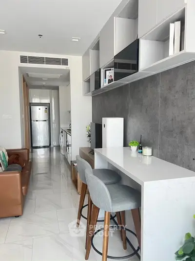 Modern kitchen with sleek design and bar stools