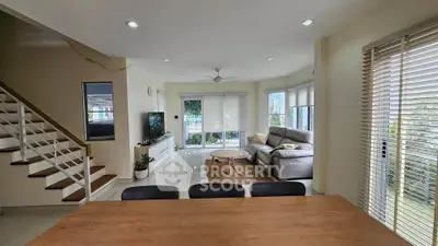 Spacious modern living room with natural light and stylish decor