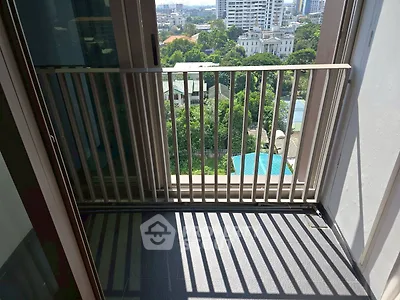 Charming balcony with city view, perfect for relaxation and enjoying the urban landscape.