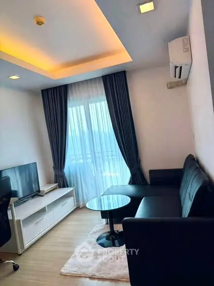 Modern living room with sleek furniture and ambient lighting in a stylish apartment.