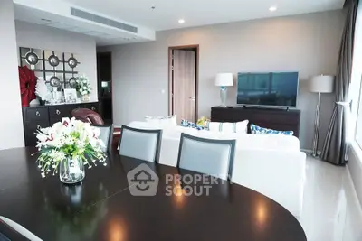 Spacious modern living room with elegant decor and large windows