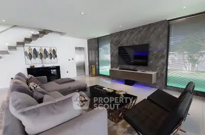 Luxurious modern living room with elegant decor and large TV