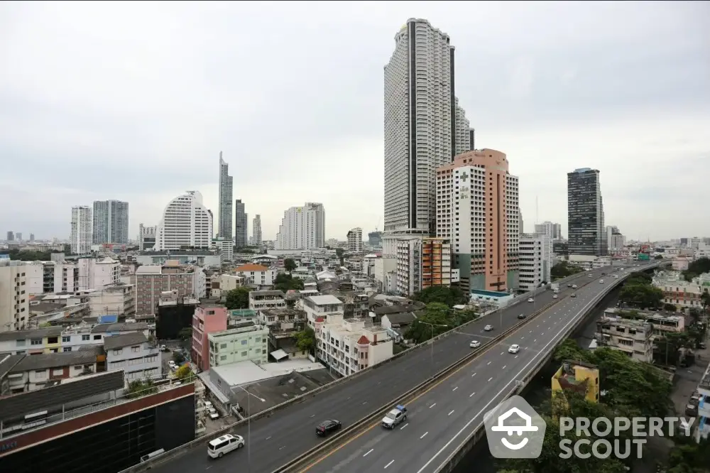 Stunning cityscape view with skyscrapers and highway, ideal for urban living enthusiasts.