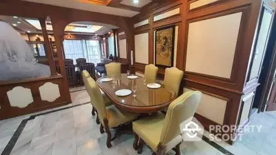 Elegant dining room with classic wooden paneling and stylish furniture