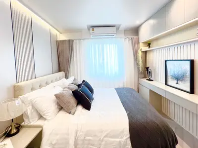 Elegant bedroom with modern decor and natural light